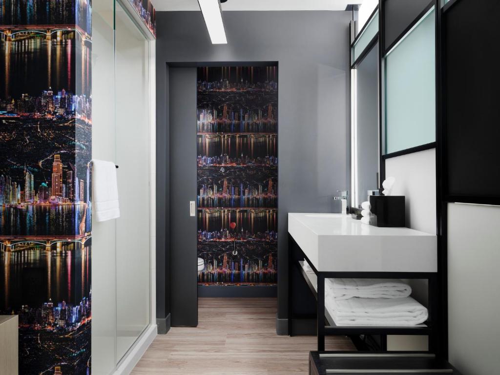 Queen Room with Two Queen Beds Mobility and Hearing Accessible Transfer Shower