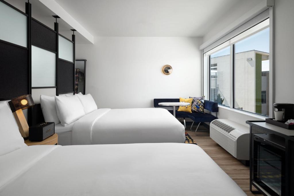 Queen Room with Two Queen Beds Mobility and Hearing Accessible Transfer Shower