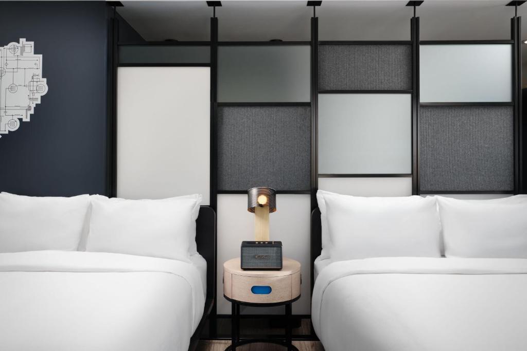 Queen Room with Two Queen Beds Mobility and Hearing Accessible Transfer Shower