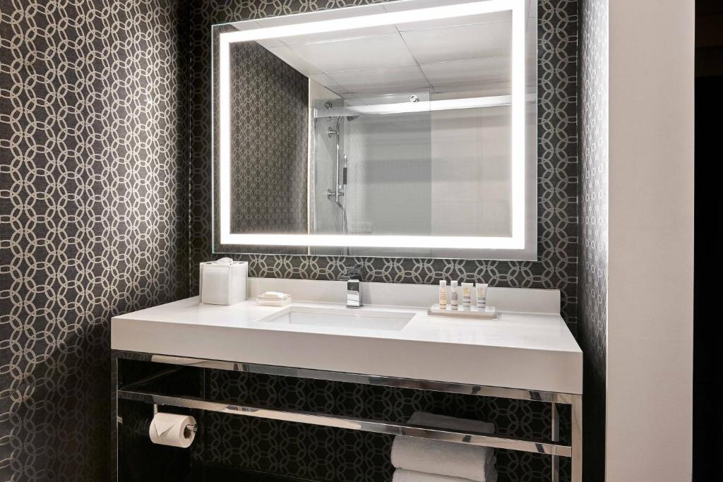 Guest Room with Two Double Beds Balcony and Pool View