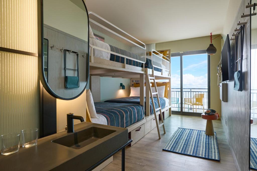 Queen Room with Four Queen Bunk Beds Oceanfront and Balcony