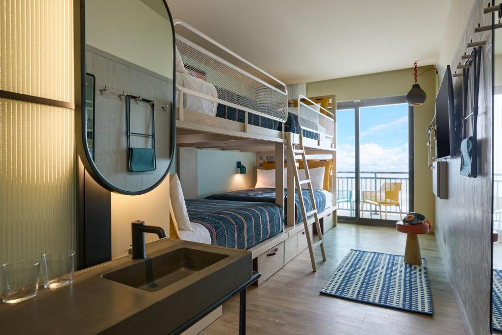 Queen Room with Four Queen Bunk Beds Oceanfront and Balcony